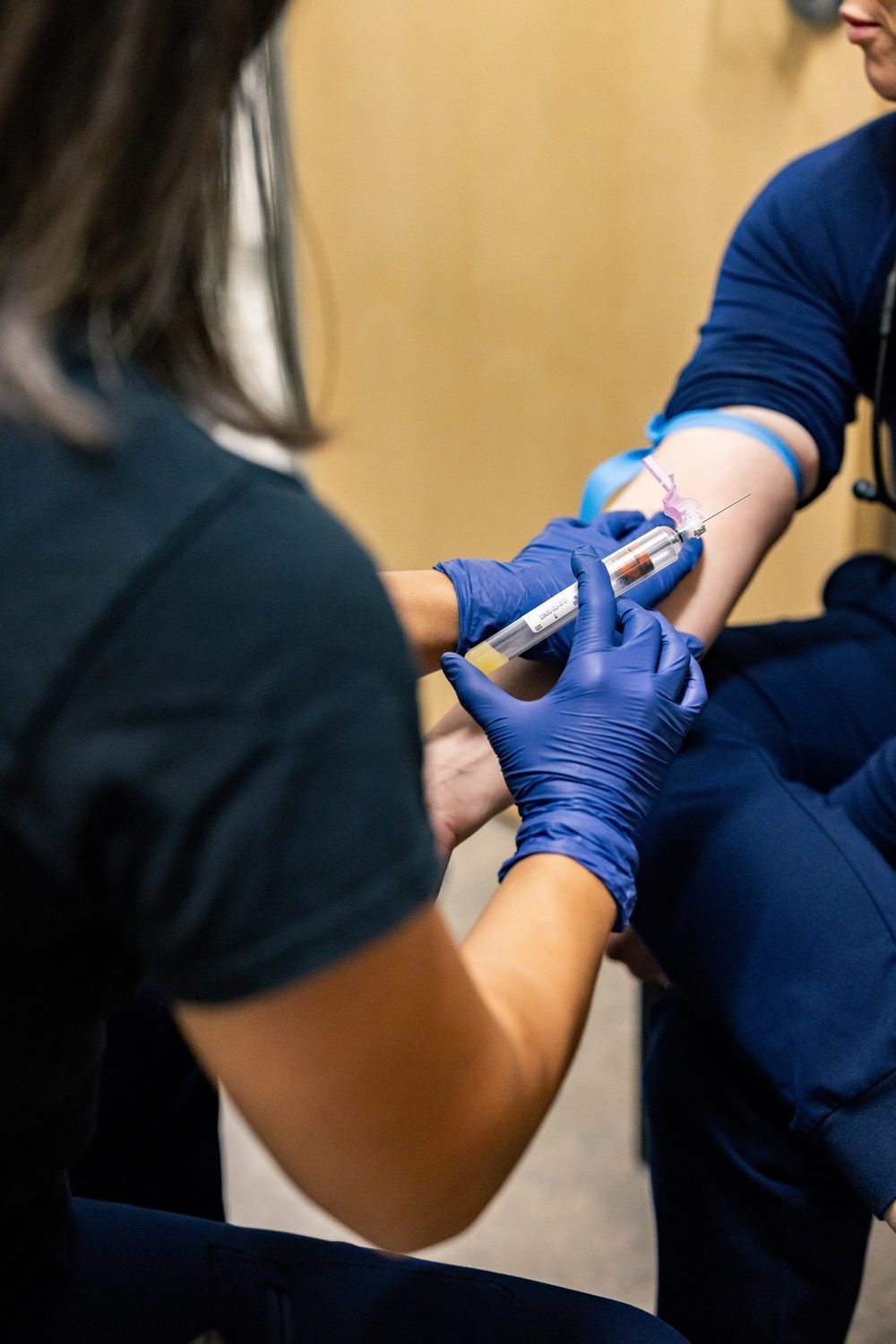A blood draw in an exam room at Prime Direct Health