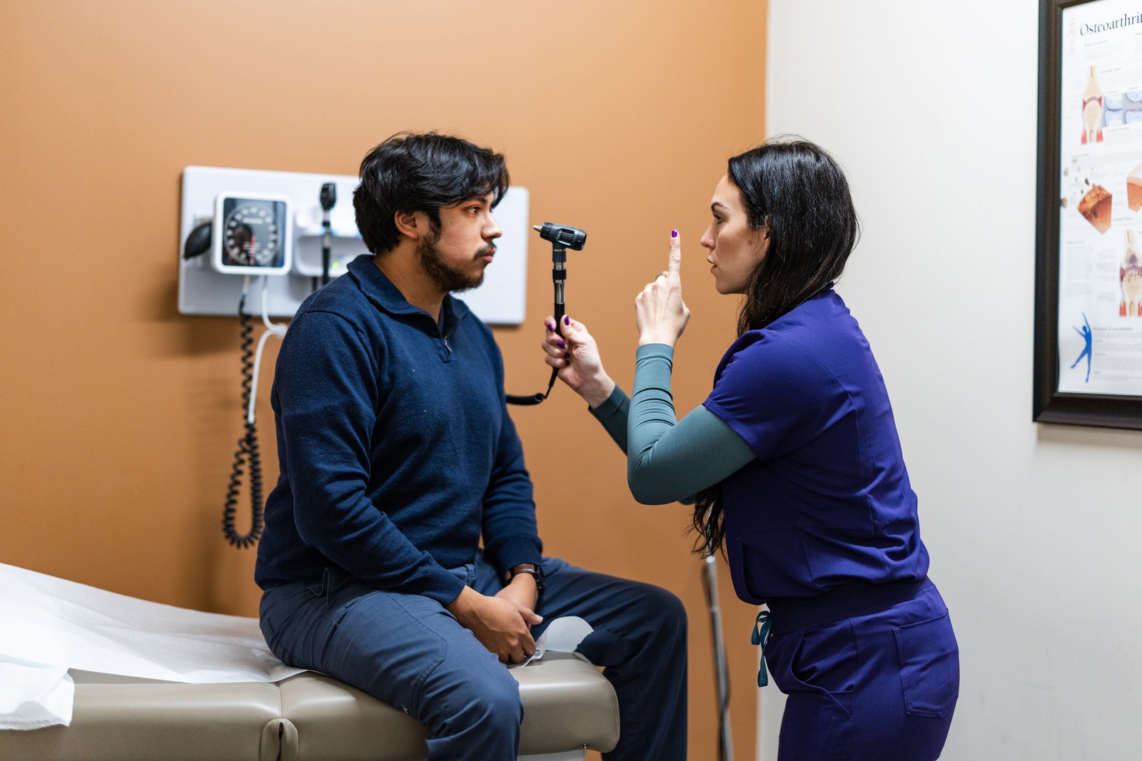 Deedee Keeler examining a patient during an annual physical at Prime Direct Health in Gilbert